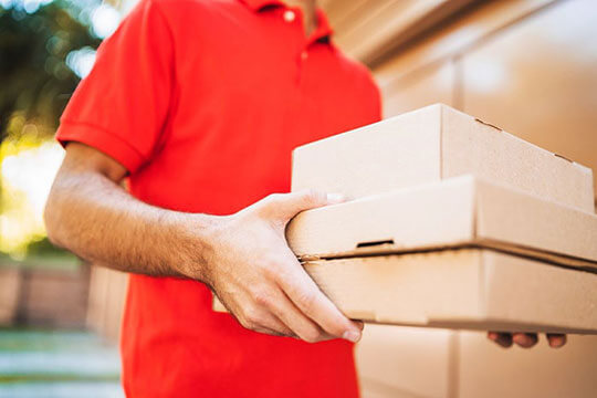 delivery boy holding parcels
